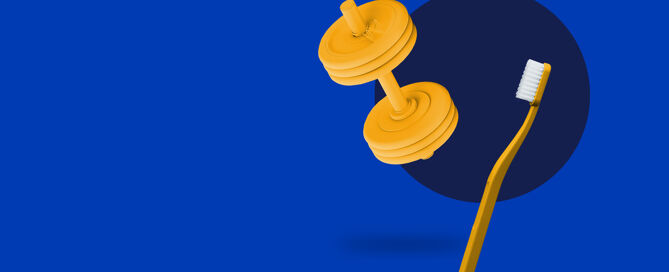 Eine gelbe Zahbürste und eine gelbe Hantel auf blauem Hintergrund