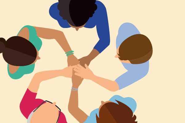 2026-magazin-01-newsletter-highlight-600x400px Eine Cartoonabbildung aus der Vogelperspective bei der 5 Personen die Hände in der Mitte übereinanderlegen.